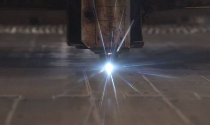 A photo of a laser cutter in action.